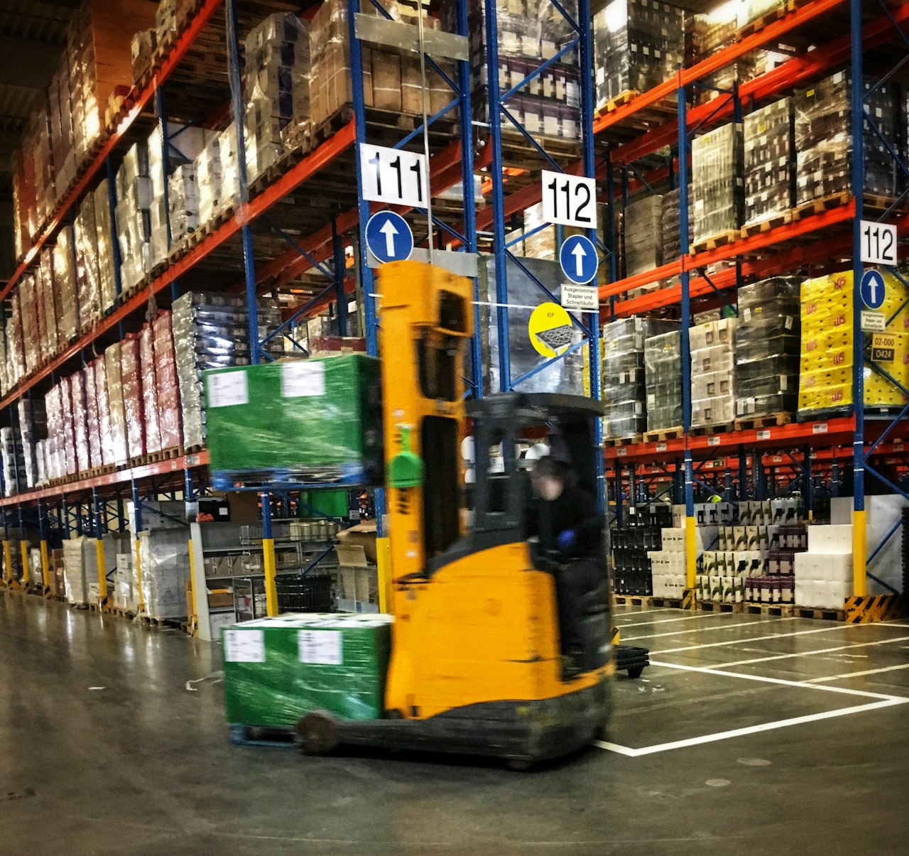 A warehouse with tall racking. Illustrative photo.