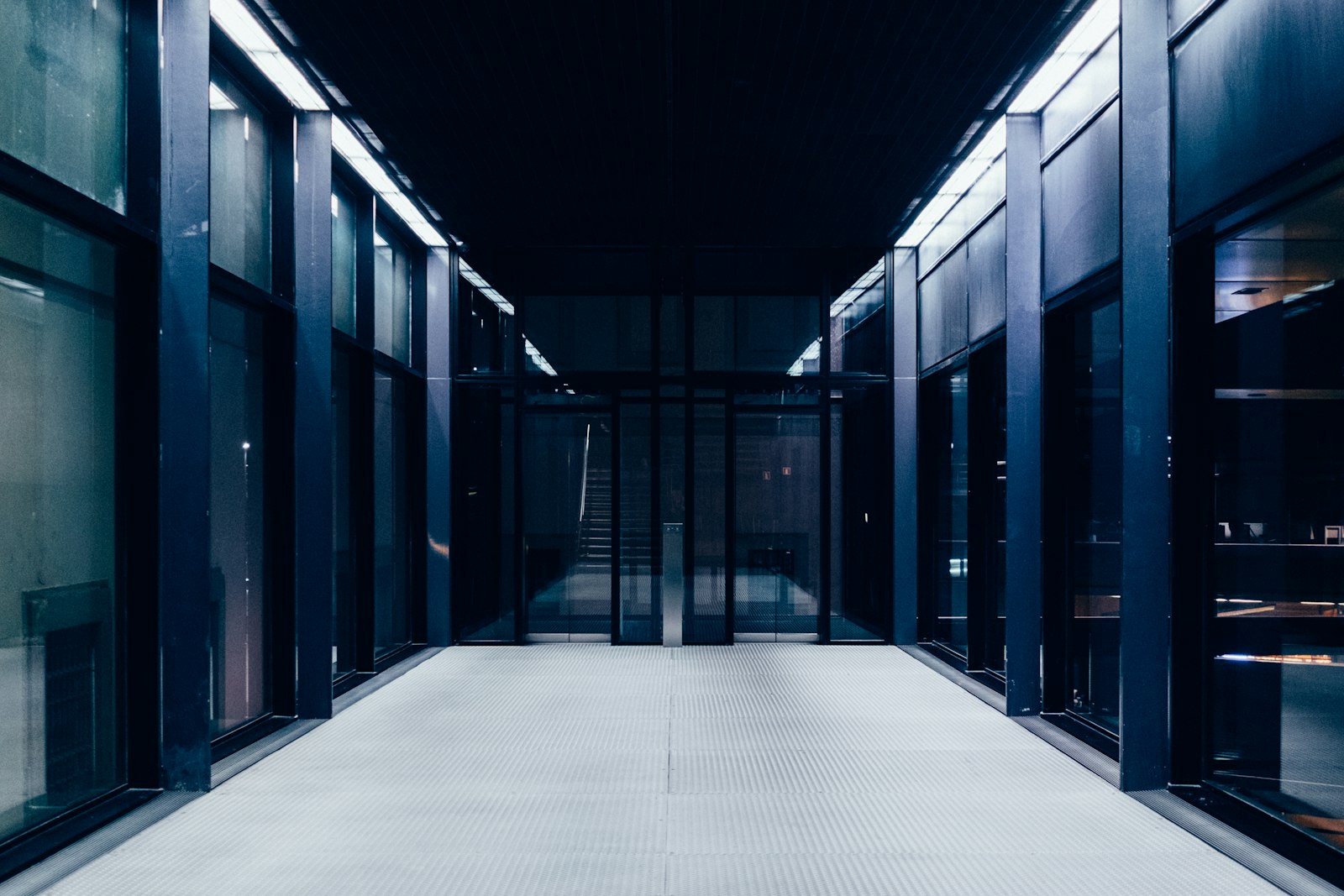 A corridor lined with server racks in a data center
