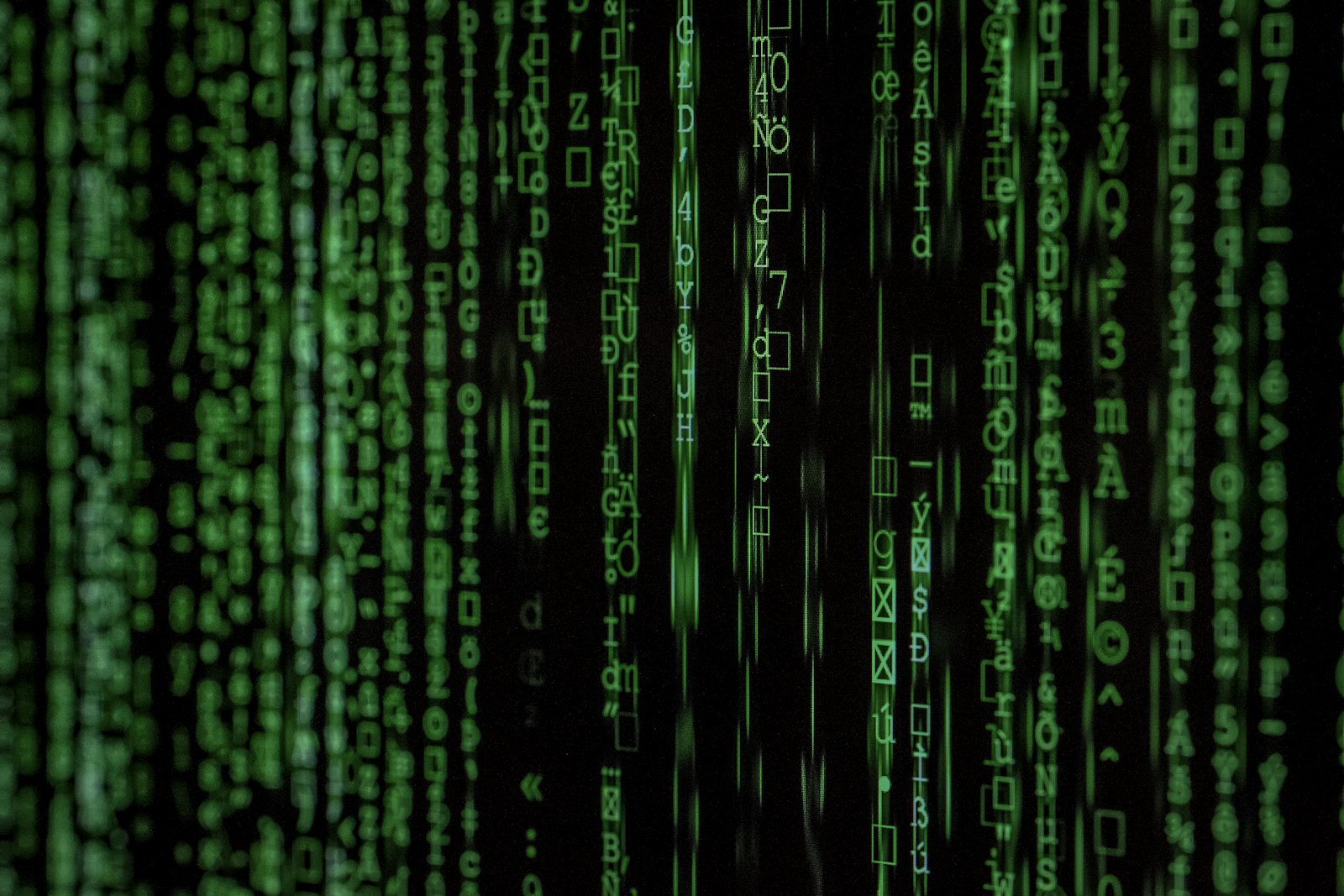 Abstract streams of code on a dark screen